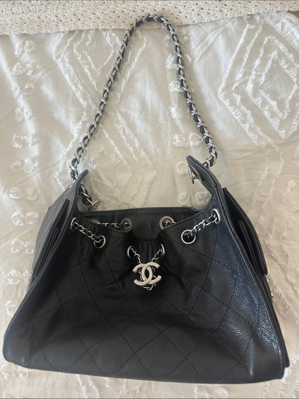 CHANEL Black Quilted Caviar Leather Drawstring Shoulder Bag with Silver Hardware